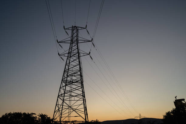 Electricity pylon against a clear sky at dusk.  Belfast, Northern Ireland.