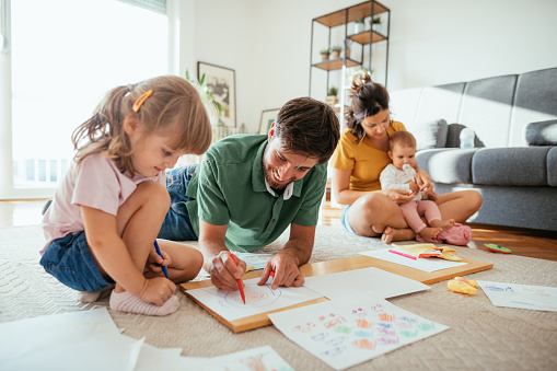 Parents playing with kids at home during coronavirus