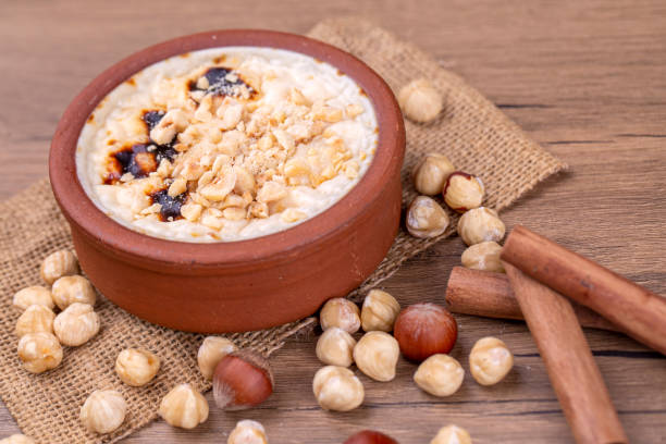 istock Baked rice pudding turkish milky dessert sutlac in earthenware casserole with hazelnuts 1273759721