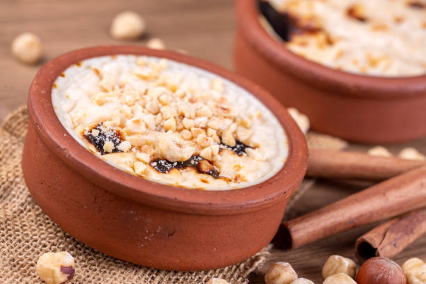 istock Baked rice pudding turkish milky dessert sutlac in earthenware casserole with hazelnuts 1273759798