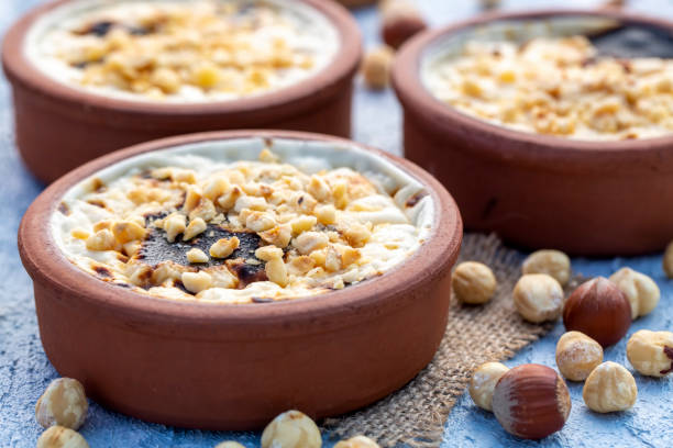 istock Baked rice pudding turkish milky dessert sutlac in earthenware casserole with hazelnuts 1273760384
