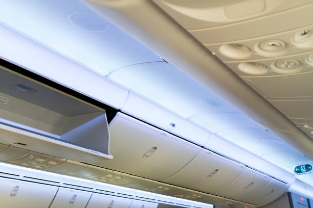 istock Airplane cabin luggage storage 1273760440