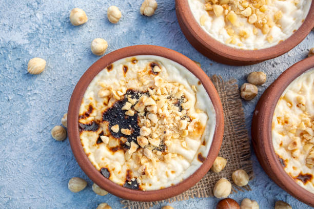 istock Baked rice pudding turkish milky dessert sutlac in earthenware casserole with hazelnuts 1273760443