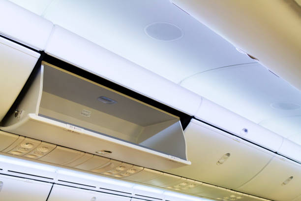 istock Airplane cabin luggage storage 1273760792
