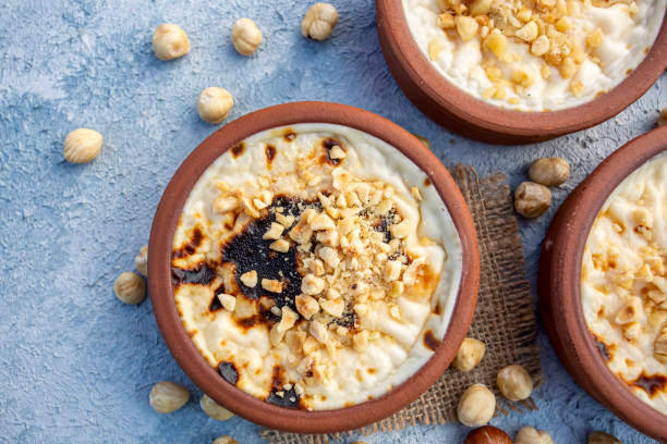 istock Baked rice pudding turkish milky dessert sutlac in earthenware casserole with hazelnuts 1273760839