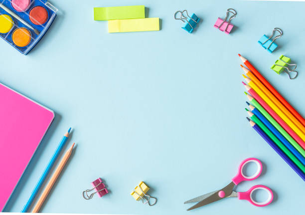 istock School supplies on a blue background. 1273761616