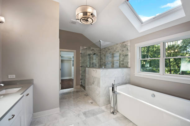 Gorgeous shower and freestanding bathtub Amazing skylight to allow light and romance free standing bath photos stock pictures, royalty-free photos & images