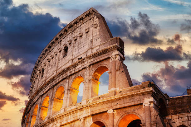 Roman Colosseum at Sunset Colosseum  in Rome at Sunset ancient history photos stock pictures, royalty-free photos & images