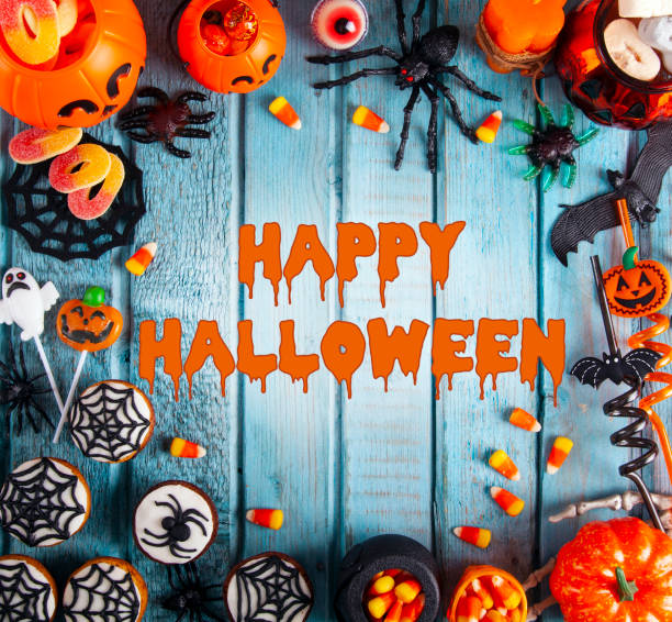 istock Halloween party decorations frame on blue wooden rustic table 1273773052