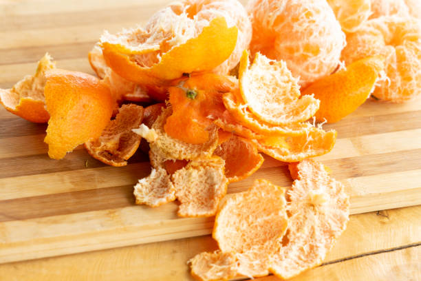 istock oranges and orange peel on a wooden chopping board 1273773767