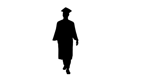 Wide shot. Front view. Silhouette Smiling African American Male Student in graduation robe walking. Professional shot in 4K resolution. 051. You can use it e.g. in your medical, commercial video, business, presentation, broadcast