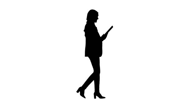 Silhouette Cute Arabian businesswoman using tablet computer whil