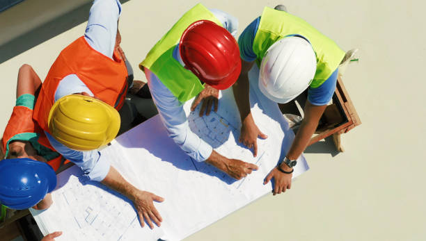 istock Group of contractors supervising building process 1273776973