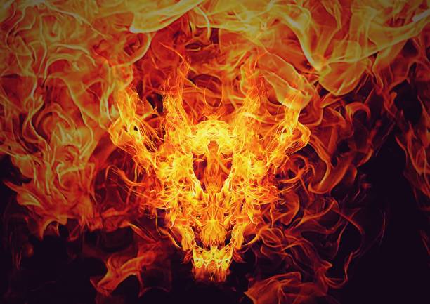 абстрактное пламя в форме лица дракона - inferno fire flame skull стоковые фото и изображения