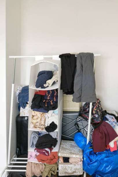 istock Clutter of things and clothes without a wardrobe 1273778615