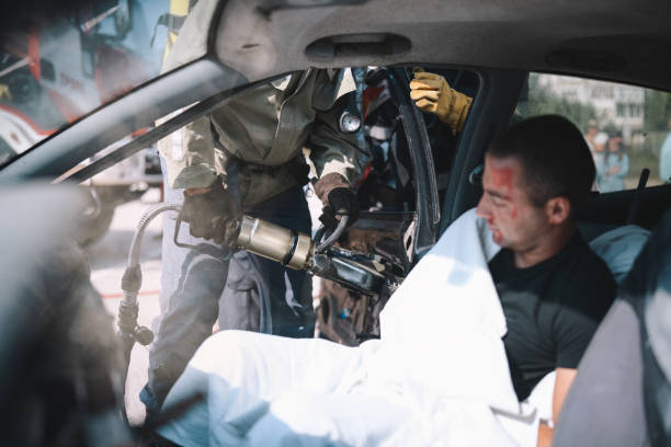 istock Firefighters Cutting Crashed Car And Rescuing The Driver From Accident. 1273778657