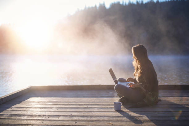 istock Woman Using Laptop In Nature. 1273778665