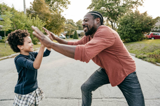 istock dad and son playing  together outdoor 1273778854