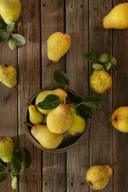 istock Fresh Organic Pears On An Old Wooden Background 1273779879