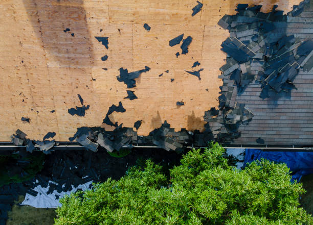 istock Home with roof replacing new shingles, felt paper, and tools 1273785830