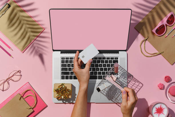 istock Flat lay laptop, credit card shopping basket 1273786366