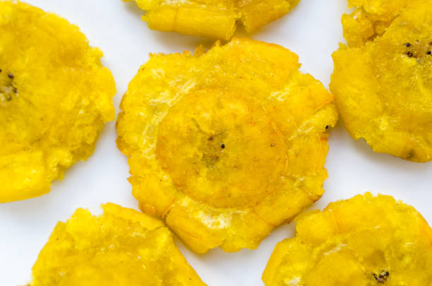 istock Patacones or tostones isolated on a white plate 1273787250
