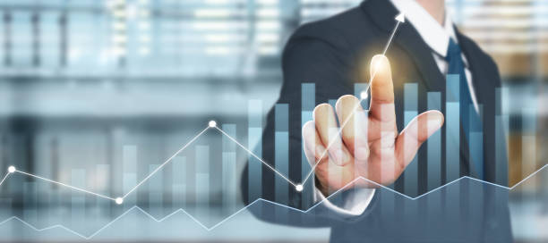 istock Businessman plan graph growth and increase of chart positive indicators in his business 1273789110