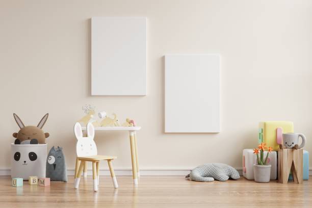 istock Mock up posters in child room interior, posters on empty cream color wall background. 1273793278