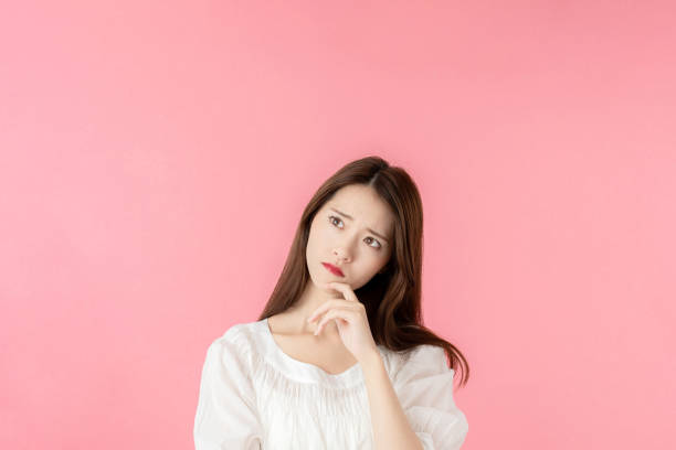 istock Thinking asian woman. 1273794068