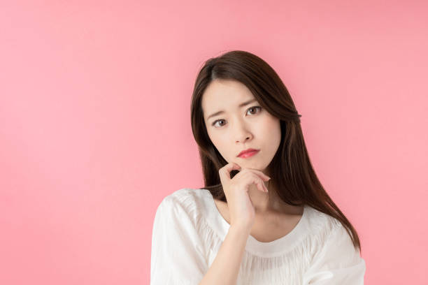 istock Thinking asian woman. 1273794083