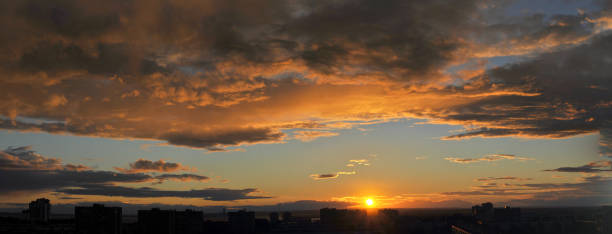 istock A panoramic view of the evening sky and clouds beautifully illuminated by the setting sun. 1273795567