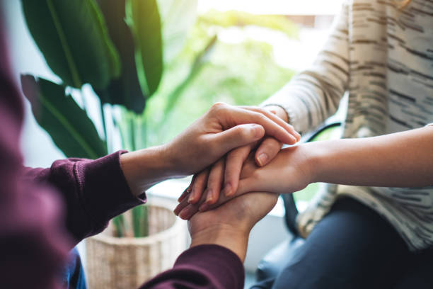 istock A man and a woman holding each other hands 1273799755
