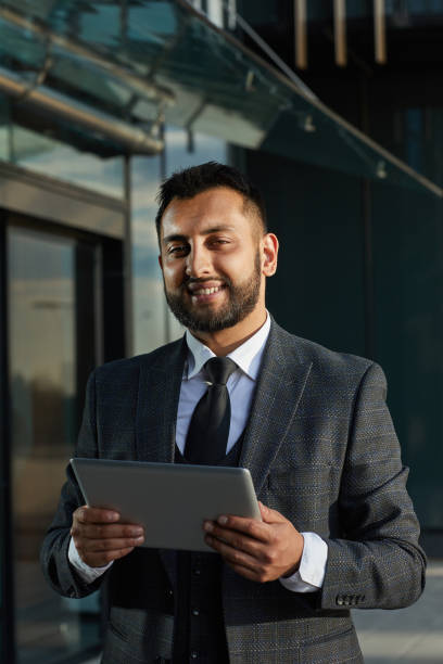 istock Businessman with tablet pc outdoors 1273800454