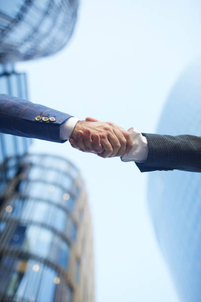istock Business handshake outdoors 1273800498