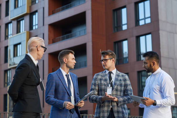 istock Business colleagues discussing outdoors 1273800537