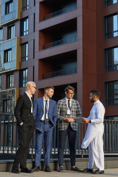 istock Business partners working outdoors 1273800564