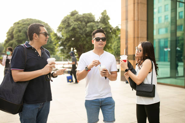 istock Friends talking  and walking at financial district 1273804082