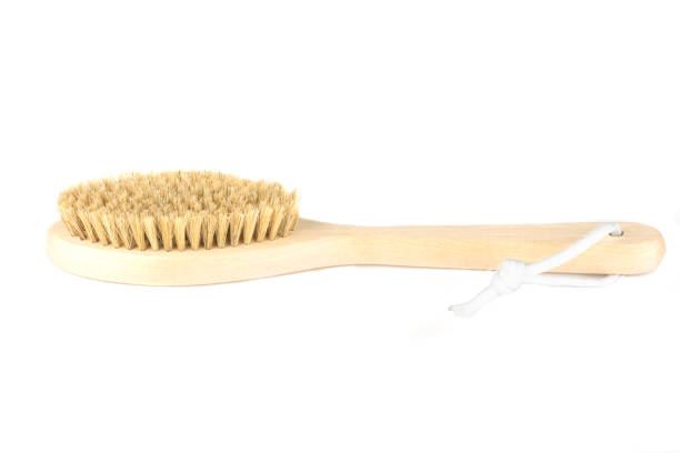 istock Wooden massage brush with handle and boar bristles. 1273804136