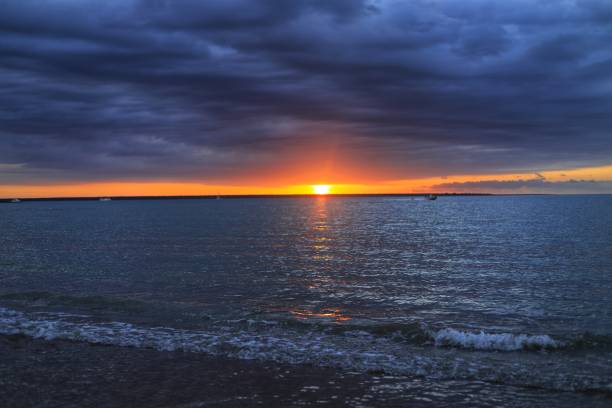 istock Stormy weather sunset beach 1273805116