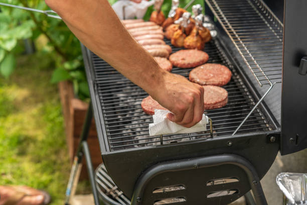 istock Mature man cooking on backyard BBQ 1273805375