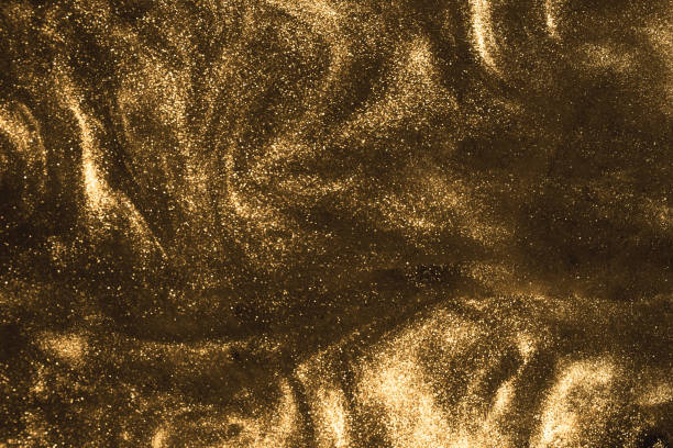 istock black and gold festive shimmering glitter background 1273805587
