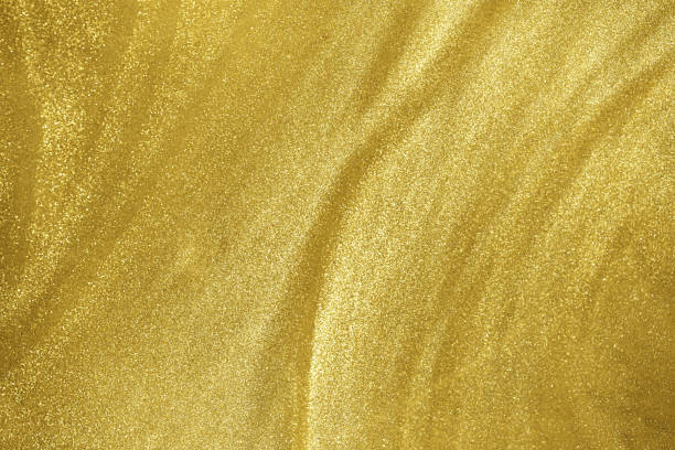 istock gold glitter shimmering magic bokeh background 1273806280