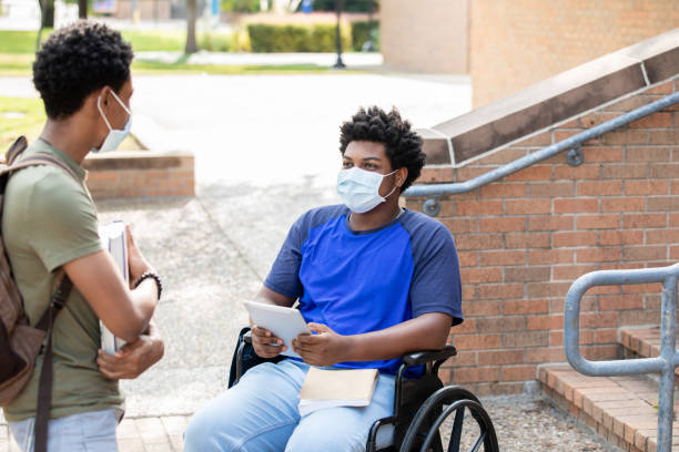 istock Two college students wearing masks while talking outdoors 1273807887