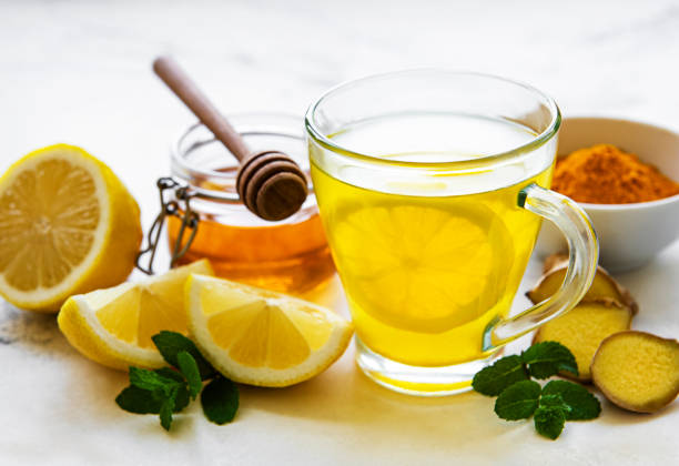 istock Energy tonic drink with turmeric, ginger, lemon and honey 1273808799