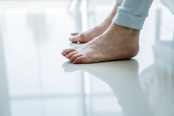 istock Cropped image of senior woman's legs on floor 1273811564