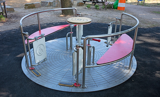 Merry go round on a childrens playground - Designed for disabled children