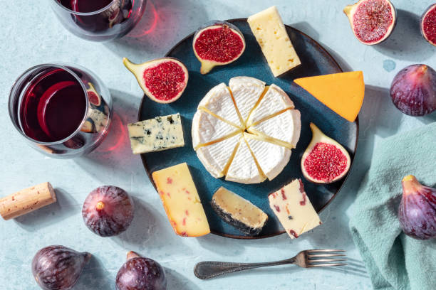 istock Cheese variety, wine and figs, flat lay, overhead shot 1273813716