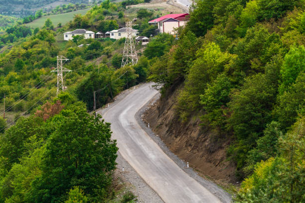 istock Empty winding road along the mountains 1273813730