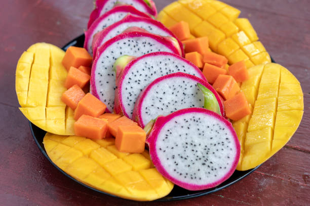 istock Tropical fruits assortment on a plate, close up 1273815958