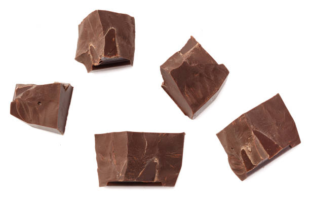 istock cracked chocolate candies sweets isolated on white background. top view 1273816063